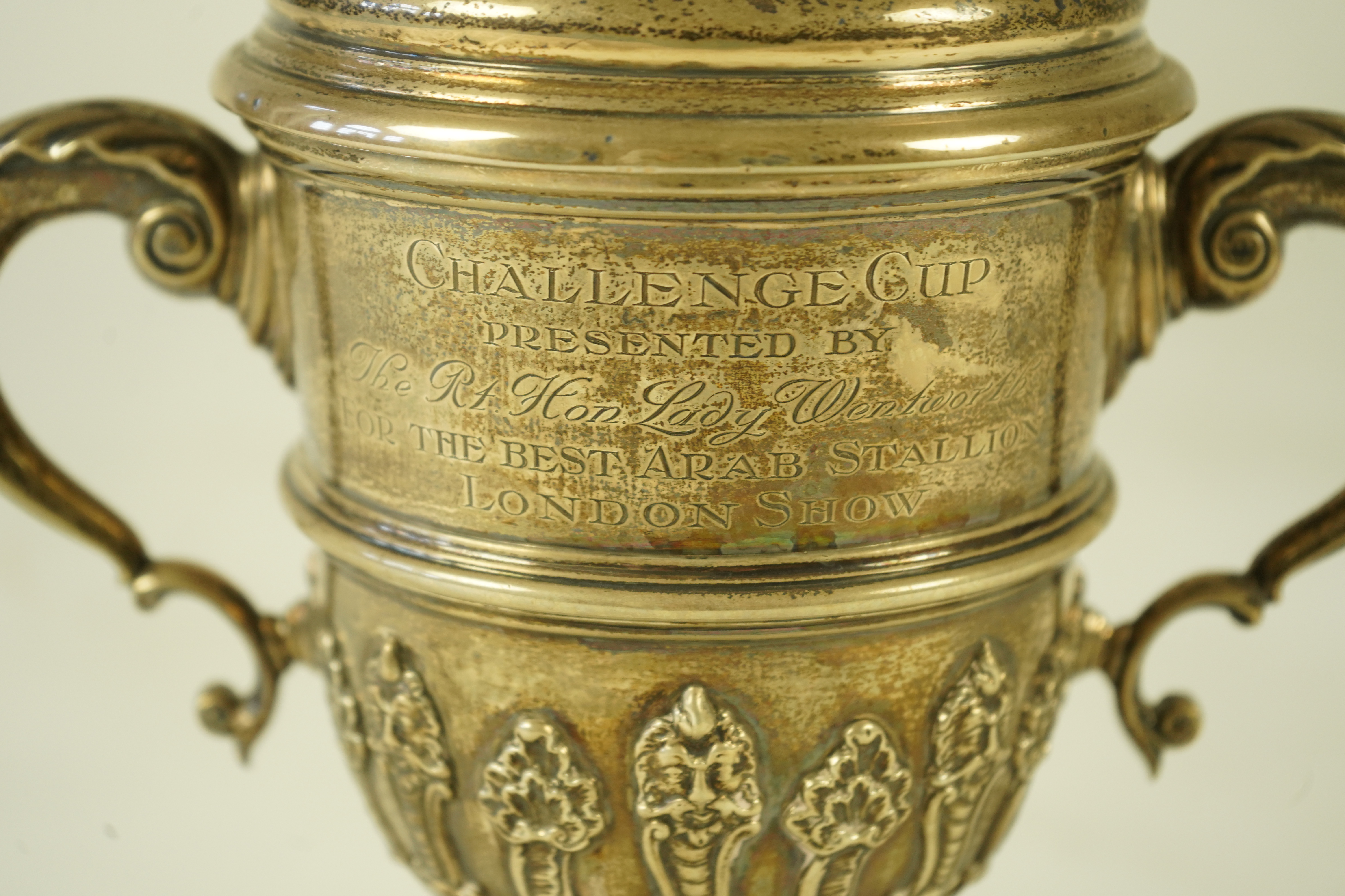 A George V silver two handled presentation cup and cover, by Charles & Richard Comyns, with engraved horse racing inscription relating to 'The Arab Horse Society Challenge Cup Presented by The Rt. Hon. Lady Wentworth for